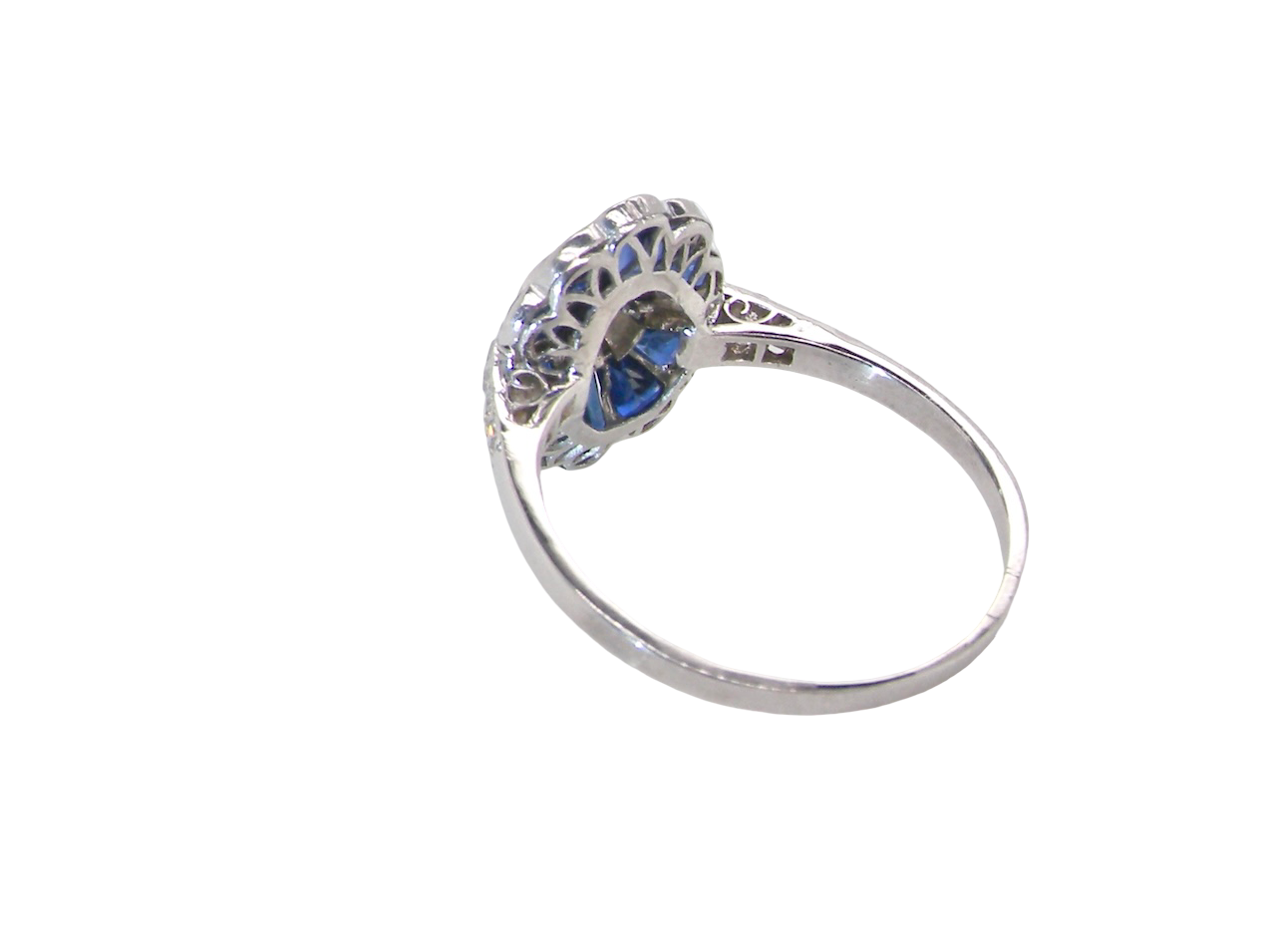 A highly unusual Art Deco cluster ring featuring a distinctive fan-shaped design.