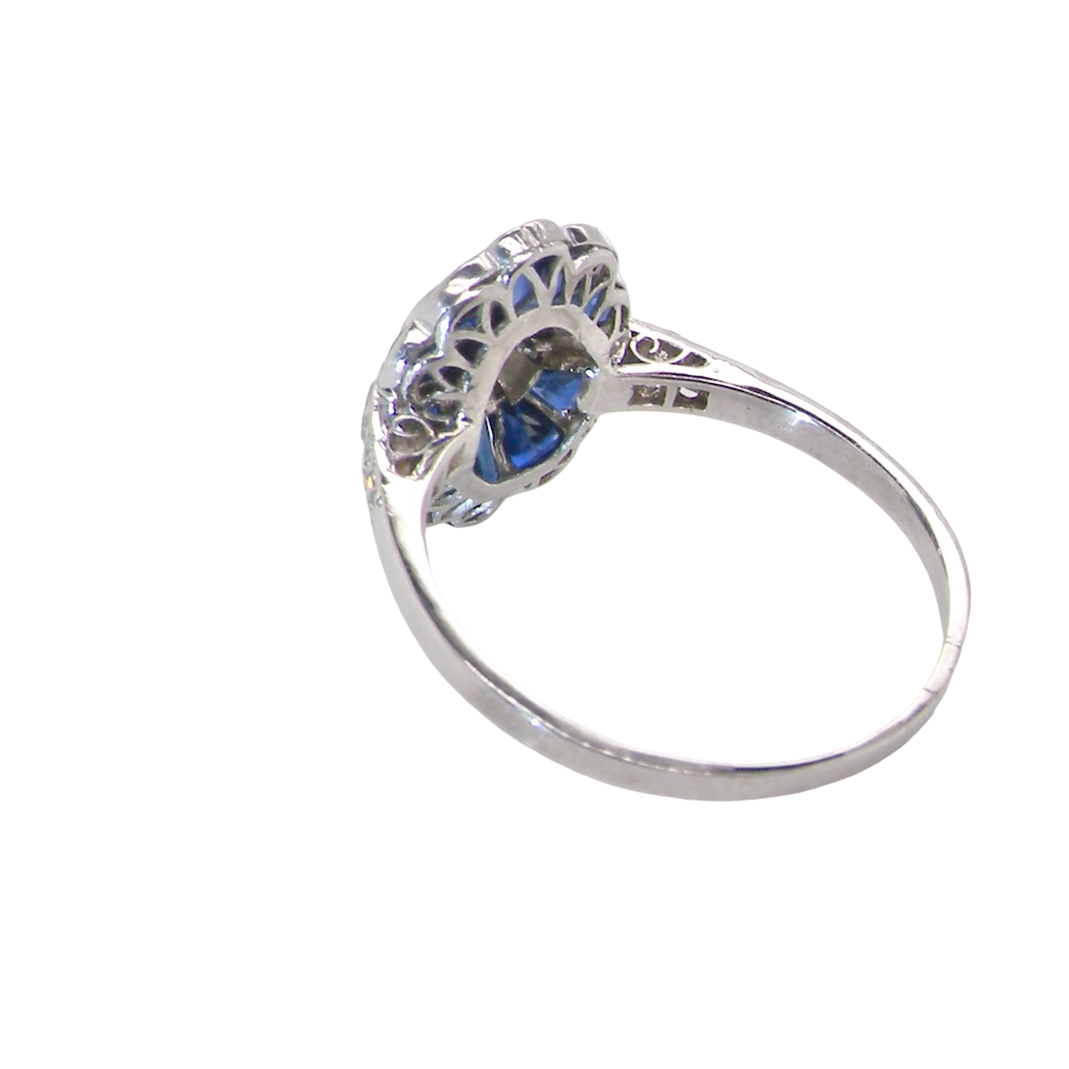 A highly unusual Art Deco cluster ring featuring a distinctive fan-shaped design.