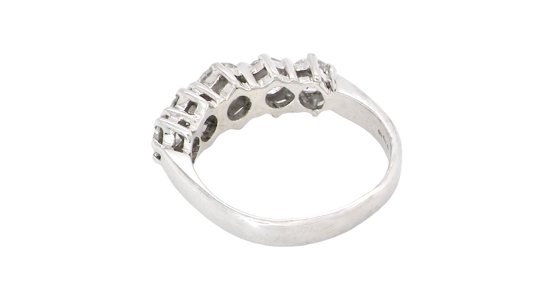 rear A stunning half hoop ring featuring five exceptional brilliant-cut white diamonds, expertly claw set in 18ct white gold.
The centre diamond measures approximately 5.8mm (estimated 0.70 carats), flanked by a 5.0mm diamond on each side, with 4.5mm diamonds at each end.