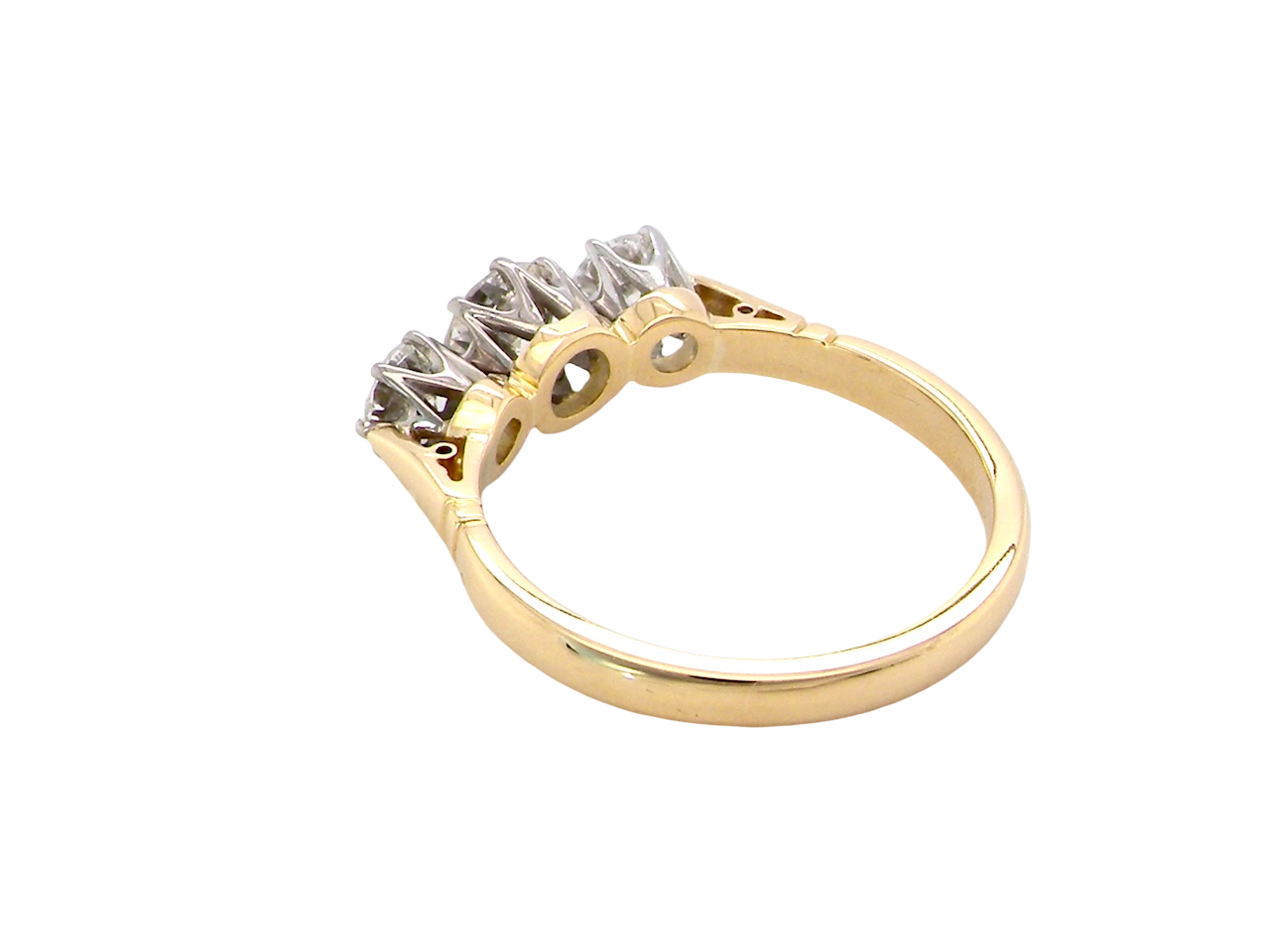 rear A three stone trilogy ring. The diamond centre stone measures 5.5mm (est 0.60 carats) each side a 4mm diamond , total estimated at 1.10 carats.