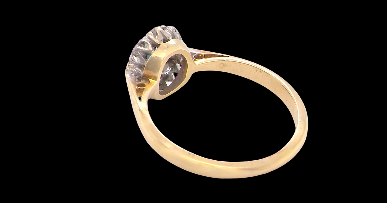 rear A traditional 1970s cluster ring featuring a rectangular-cut sapphire,