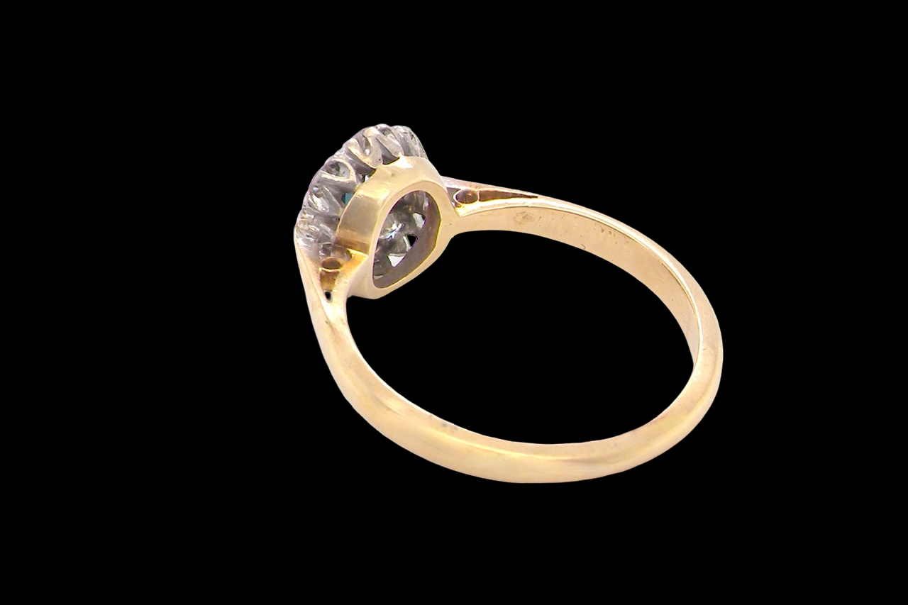 rear A traditional 1970s cluster ring featuring a rectangular-cut sapphire,