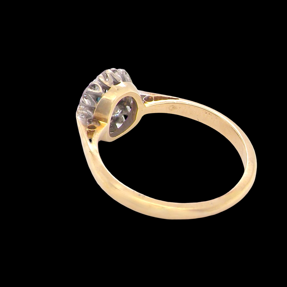 rear A traditional 1970s cluster ring featuring a rectangular-cut sapphire,
