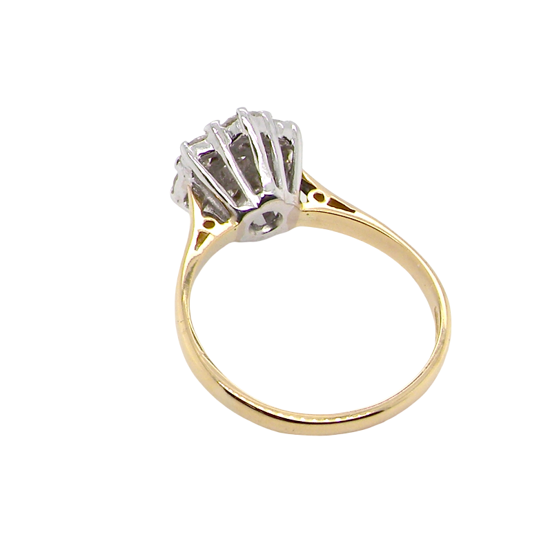 rear A traditional cluster ring. Features to the centre a 3.4mm brilliant cut white diamond (est 0.15 carats)
Surrounded by six 3.4mm diamonds to match