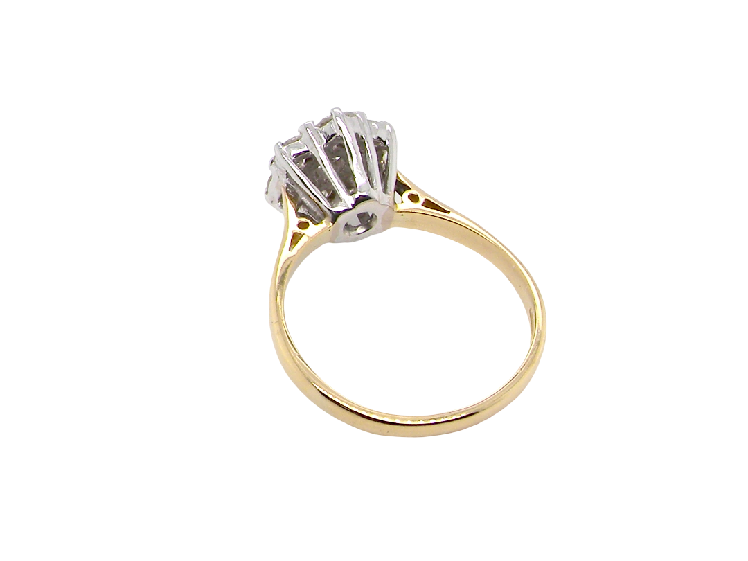 rear A traditional cluster ring. Features to the centre a 3.4mm brilliant cut white diamond (est 0.15 carats)
Surrounded by six 3.4mm diamonds to match