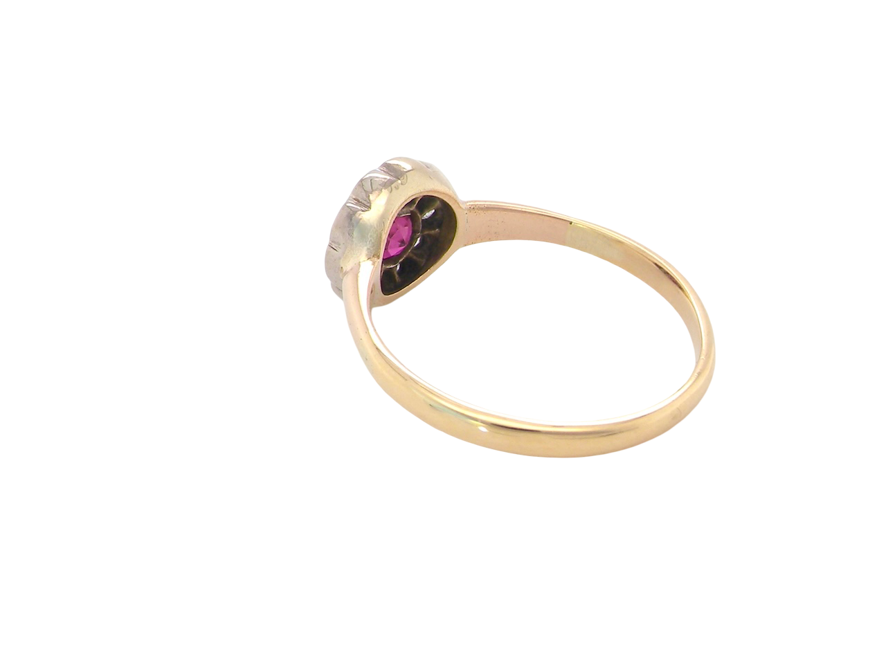 rear A very pretty vintage daisy cluster ring. Features to the centre a round pink red ruby that measures 4mm, and is mille grain set.