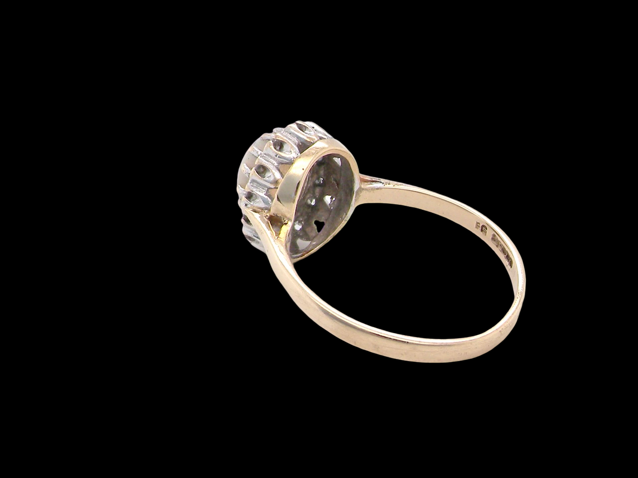 rear A vintage cluster ring set with an oval cabouchon cut opa