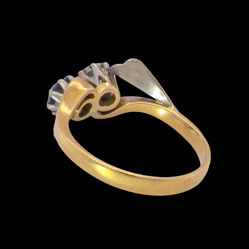 rear A vintage crossover ring. Set with a round sapphire 5mm diameter, black blue colour.