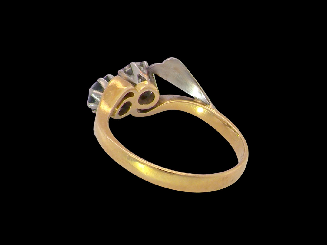 rear A vintage crossover ring. Set with a round sapphire 5mm diameter, black blue colour.