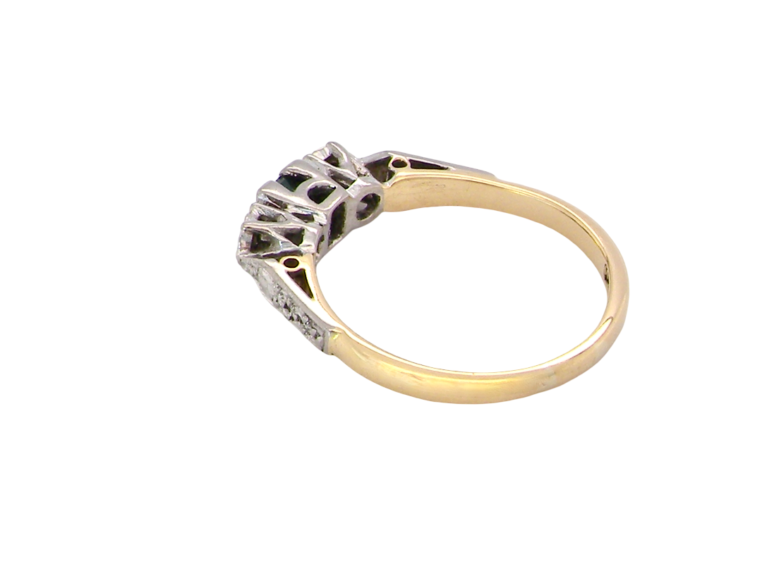 rear A vintage mid century ring. Centre stone a square emerald 3x3mm (0.15 carats est), rim setting.