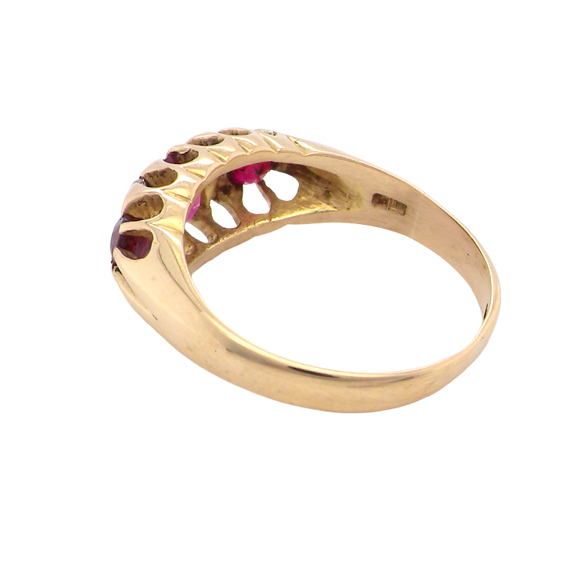 rear An 18 carat gold antique boat shaped ring. Features three lovely coloured wine red rubies, centre 5x4mm, each end 2.4mm.