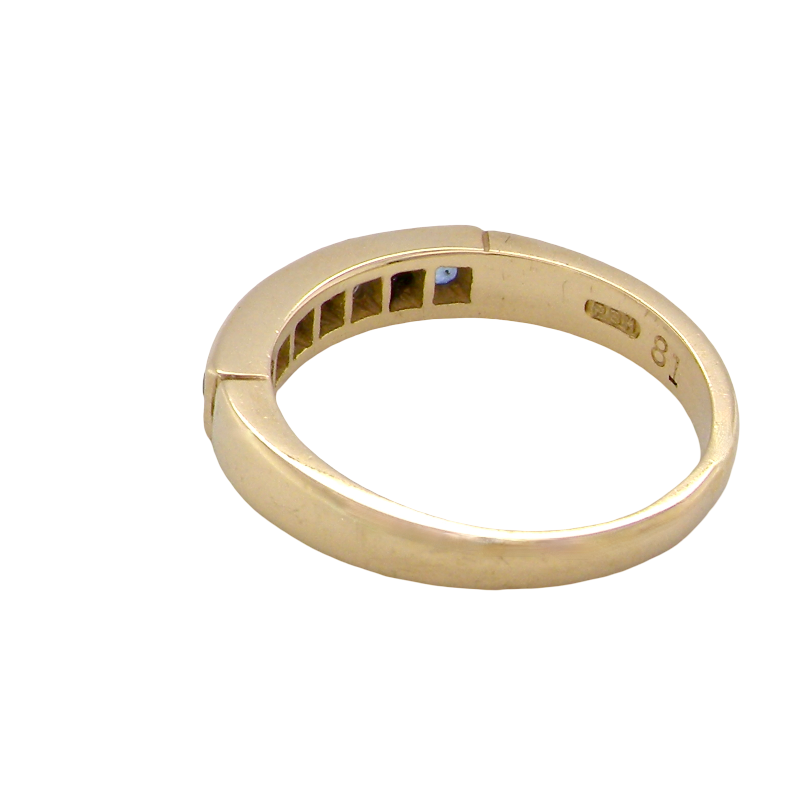rear An 18 carat gold half hoop eternity ring.
Features four round sapphires , each 2.4mm,