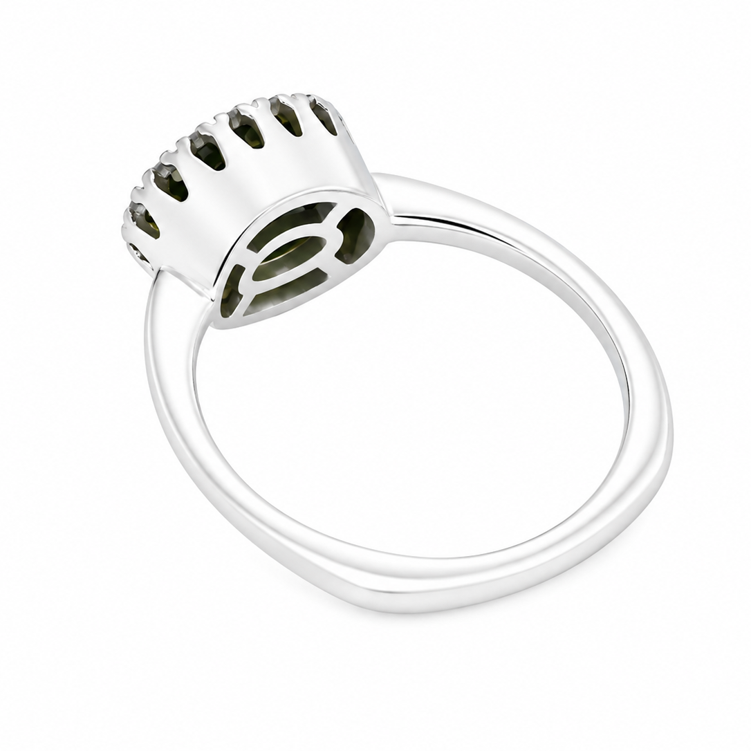 rear An 18 carat white gold* cluster ring. Features and oval shaped peridot gemstone, measures 8.5x6.5mm.