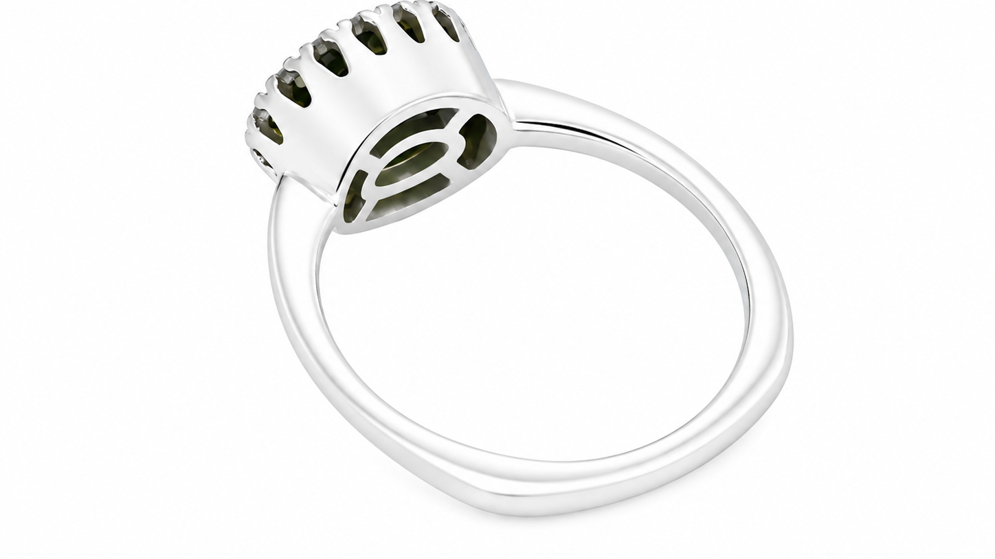 rear An 18 carat white gold* cluster ring. Features and oval shaped peridot gemstone, measures 8.5x6.5mm.