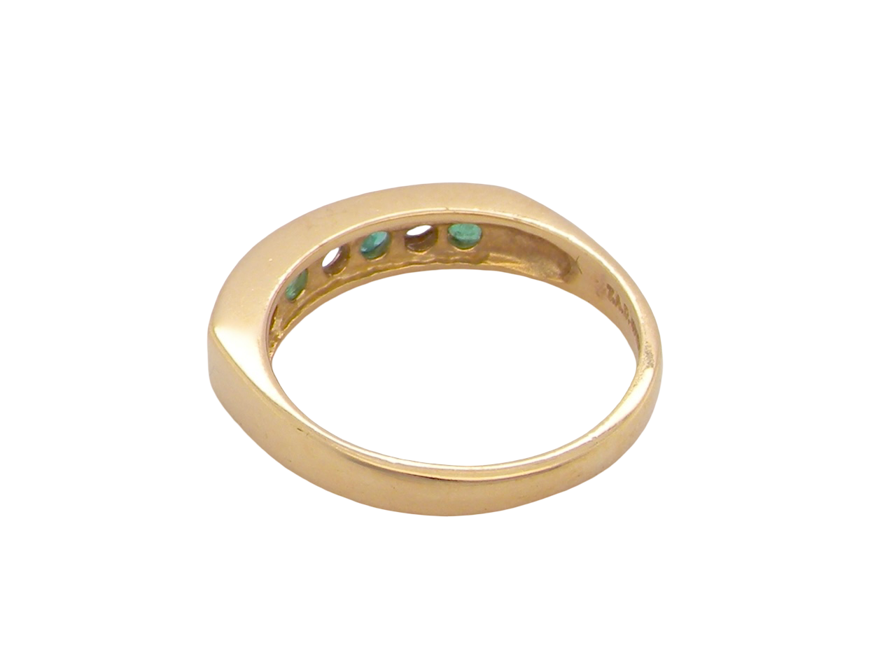 rear An 18 carat yellow gold half hoop eternity ring. Set with four round emeralds, each 3mm, and alternate set with brilliant cut white diamonds, each 3mm (total est 0.30 carats)