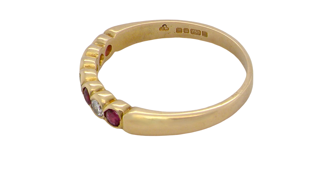 rear An 18 carat yellow gold half hoop eternity ring. Set with four rubies, 3mm each.
Set with alternate diamonds, each 3mm (0.10 carats each) colour i-j, clarity Si.