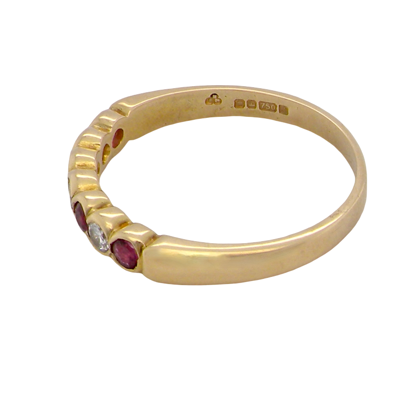 rear An 18 carat yellow gold half hoop eternity ring. Set with four rubies, 3mm each.
Set with alternate diamonds, each 3mm (0.10 carats each) colour i-j, clarity Si.