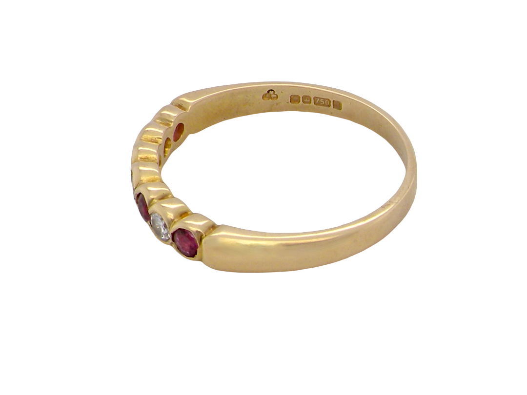 rear An 18 carat yellow gold half hoop eternity ring. Set with four rubies, 3mm each.
Set with alternate diamonds, each 3mm (0.10 carats each) colour i-j, clarity Si.