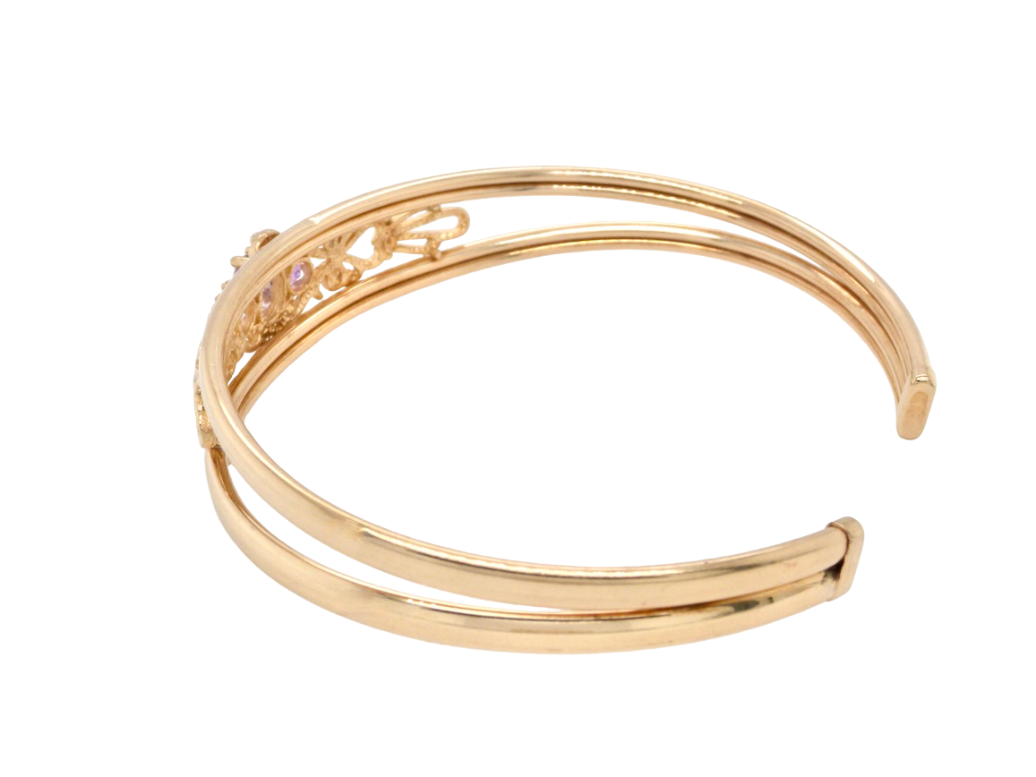 Gold bracelet on a white background