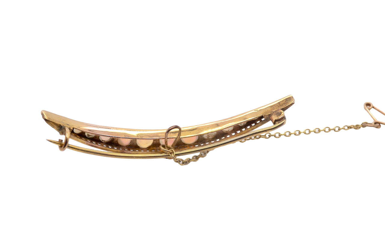 An Edwardian opal crescent shaped brooch