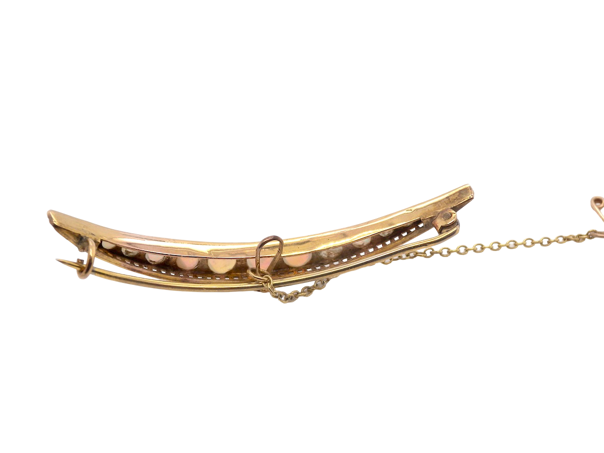 An Edwardian opal crescent shaped brooch