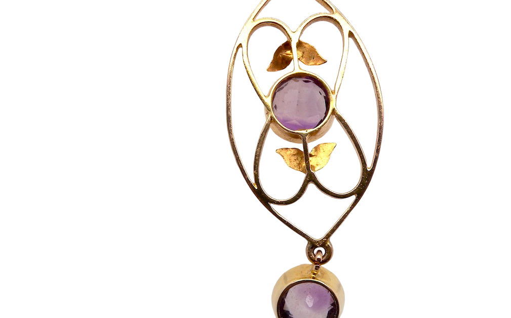 rear An Edwardian pendant set with two amethyst gemstones