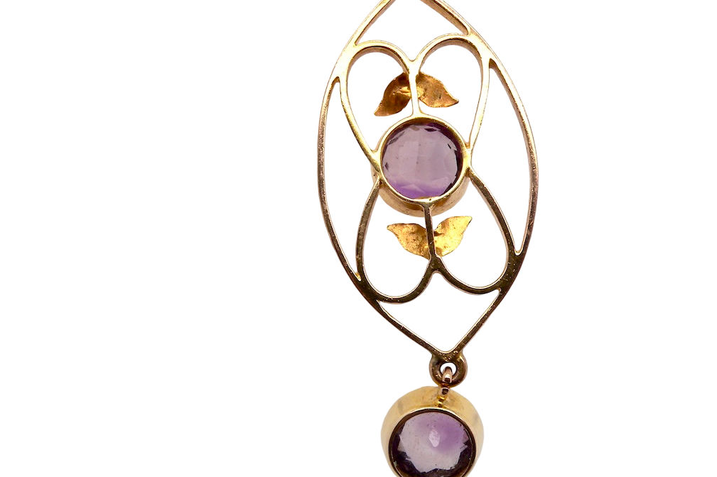 rear An Edwardian pendant set with two amethyst gemstones