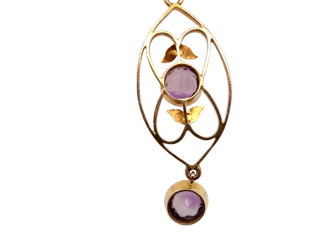 rear An Edwardian pendant set with two amethyst gemstones