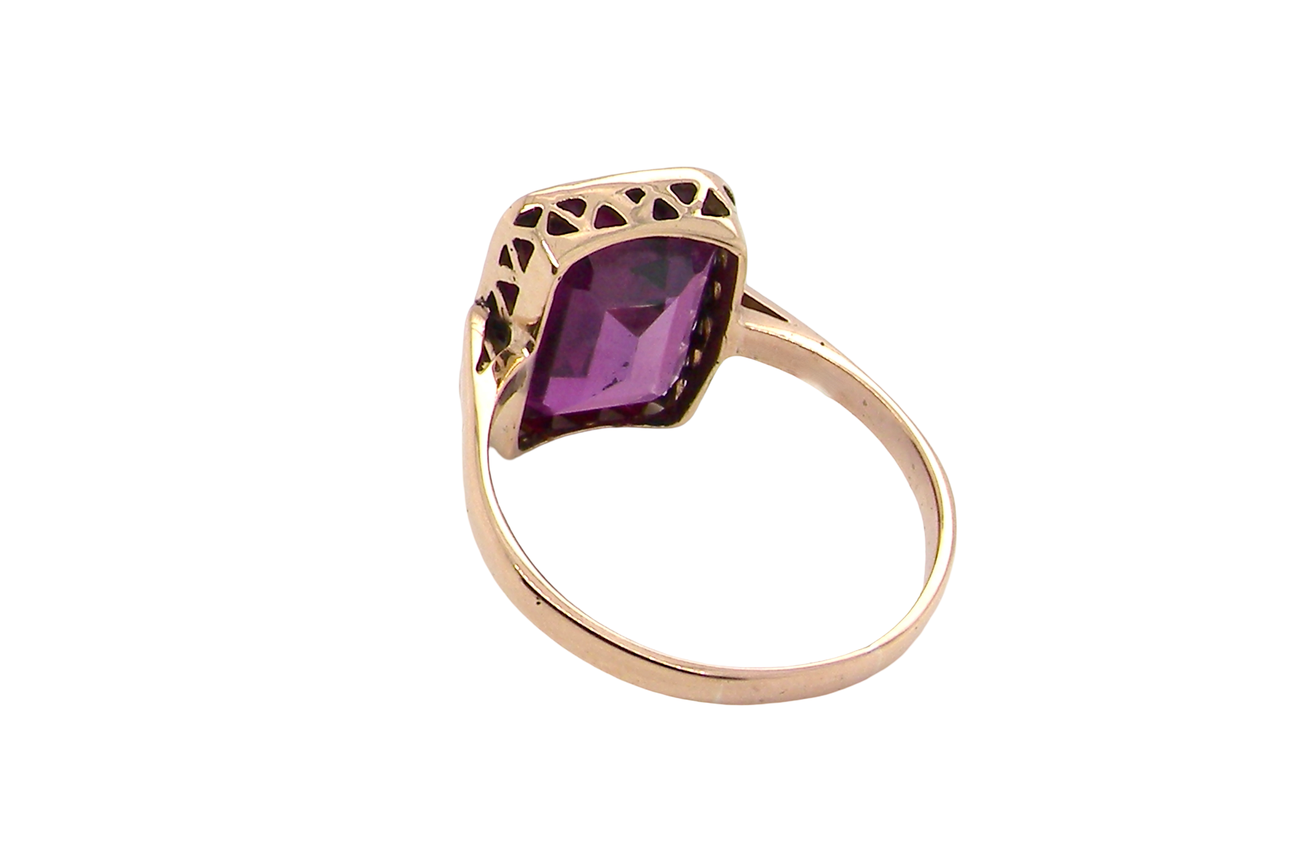 rear An antique dress ring that features a rectangular cut amethyst. Very dark purple, measures 12x10mm. Rim setting.