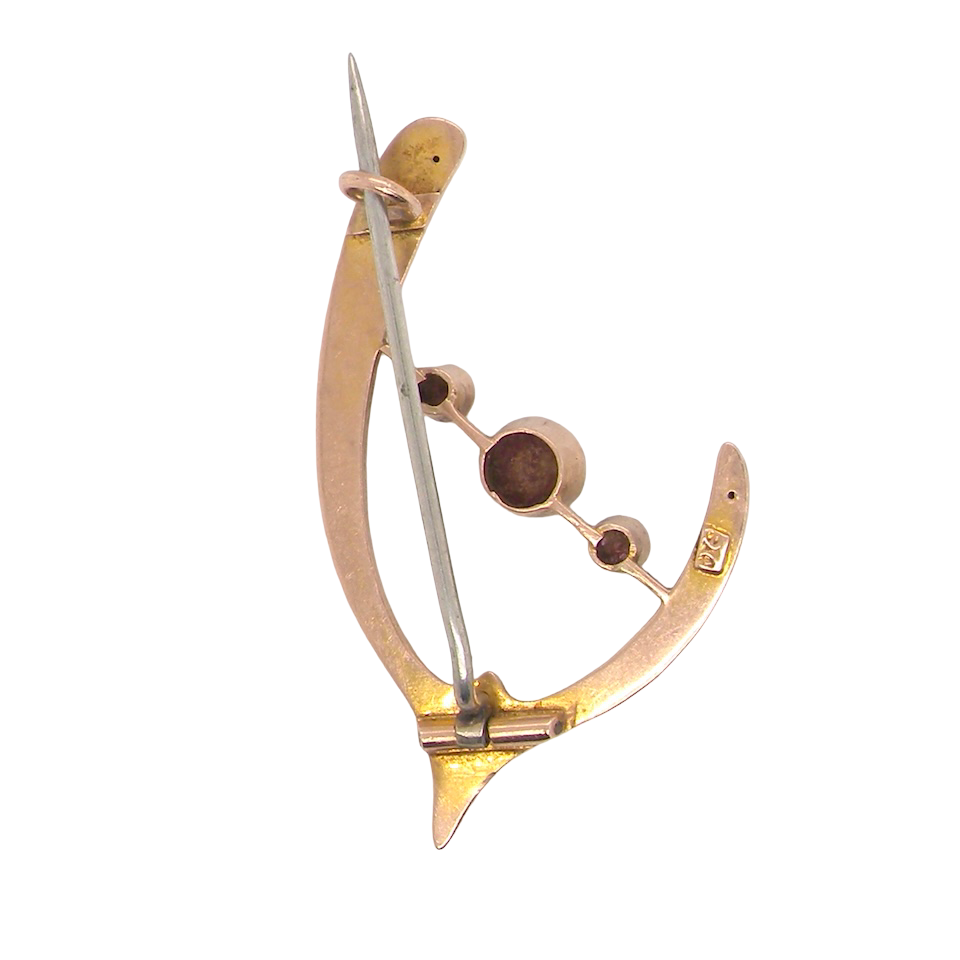 An antique wishbone shaped brooch