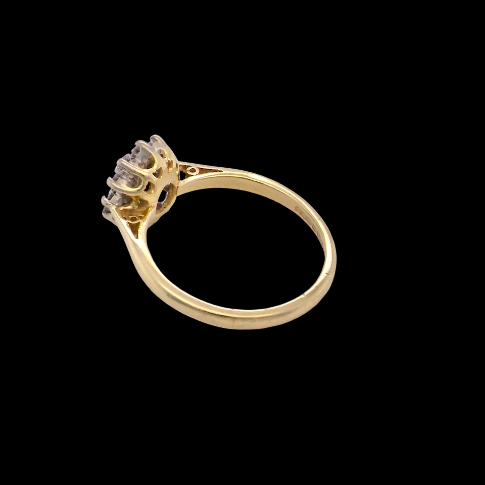 rear An elegant 18 carat gold cluster ring featuring a beautifully proportioned 6 × 4mm green tourmaline