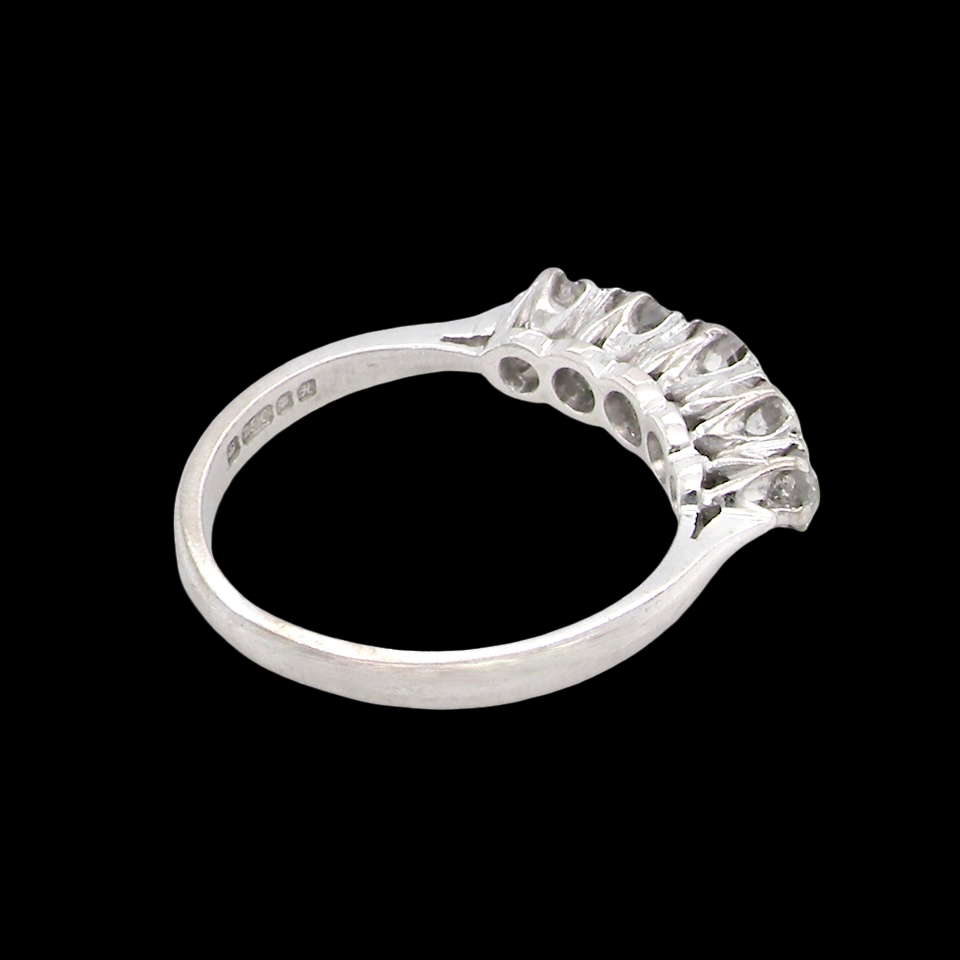 rear An elegant 18 carat white gold five-stone ring set with brilliant-cut white diamonds. The centre diamond measures 3.4mm, flanked by two 3.0mm stones and finished with 2.8mm diamonds at each end, creating a beautifully balanced graduated design.