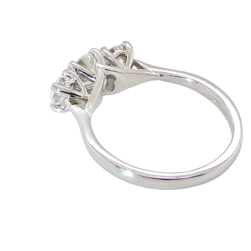rear An exceptional three stone diamond trilogy ring, beautifully crafted in platinum and set with three modern brilliant cut white diamonds.