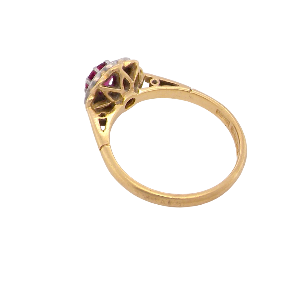 rear An exquisite vintage cluster ring centred around a 5 mm ruby,( 0.50 carats)