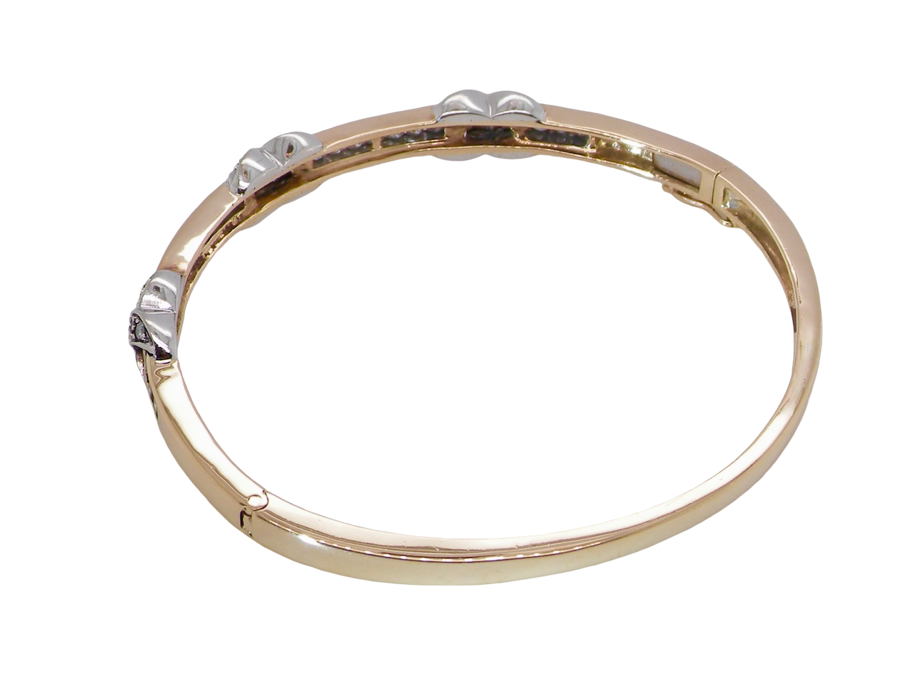 rear An impressive 9 carat gold bangle.
Three 'kiss' shaped sections , each set with nine brilliant cut white diamonds