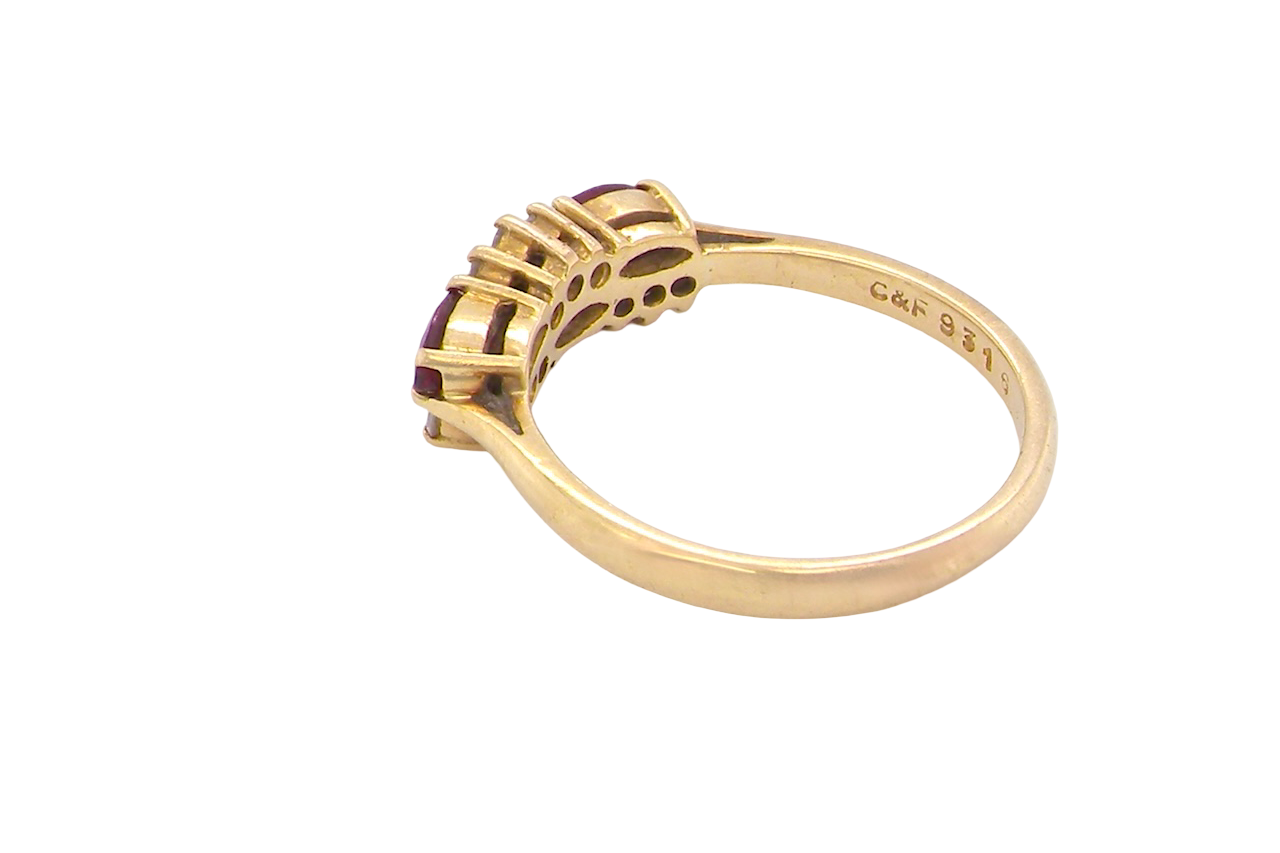 rear An unusual ring featuring three marquise-cut rubies (5×3 mm each).