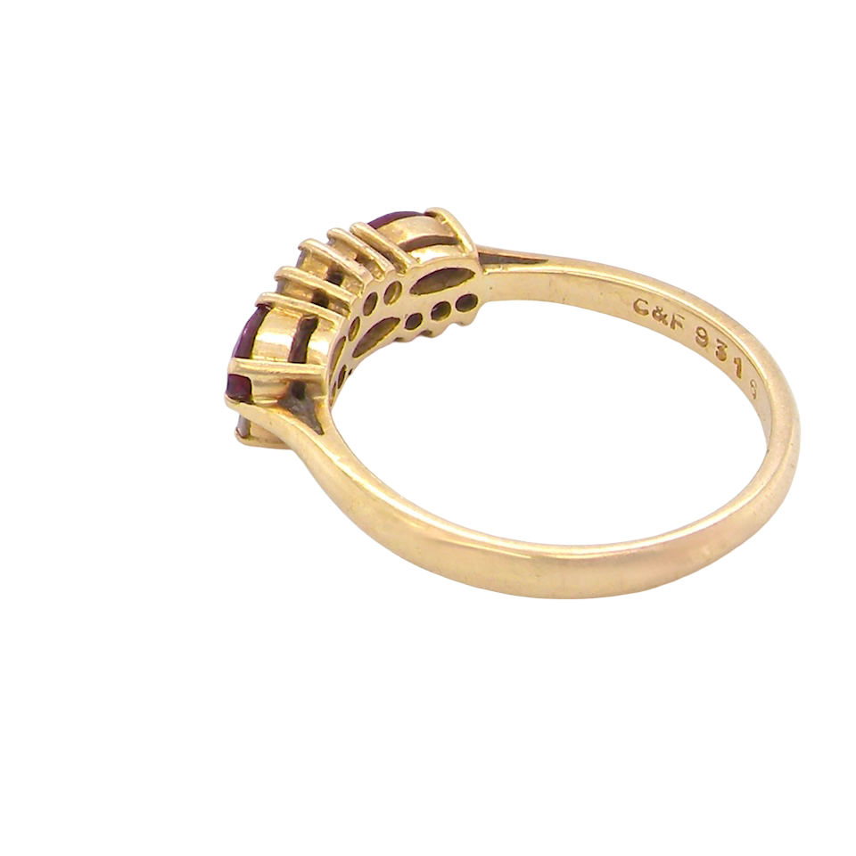 rear An unusual ring featuring three marquise-cut rubies (5×3 mm each).