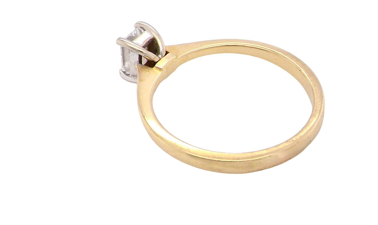 rear Elegant and timeless, this solitaire ring features a beautifully cut emerald-cut diamond measuring 5 x 4mm, confirmed at approximately 0.40 carats. The diamond is graded J colour and VS clarity, offering excellent sparkle and impressive clarity for everyday wear or a meaningful occasion piece.