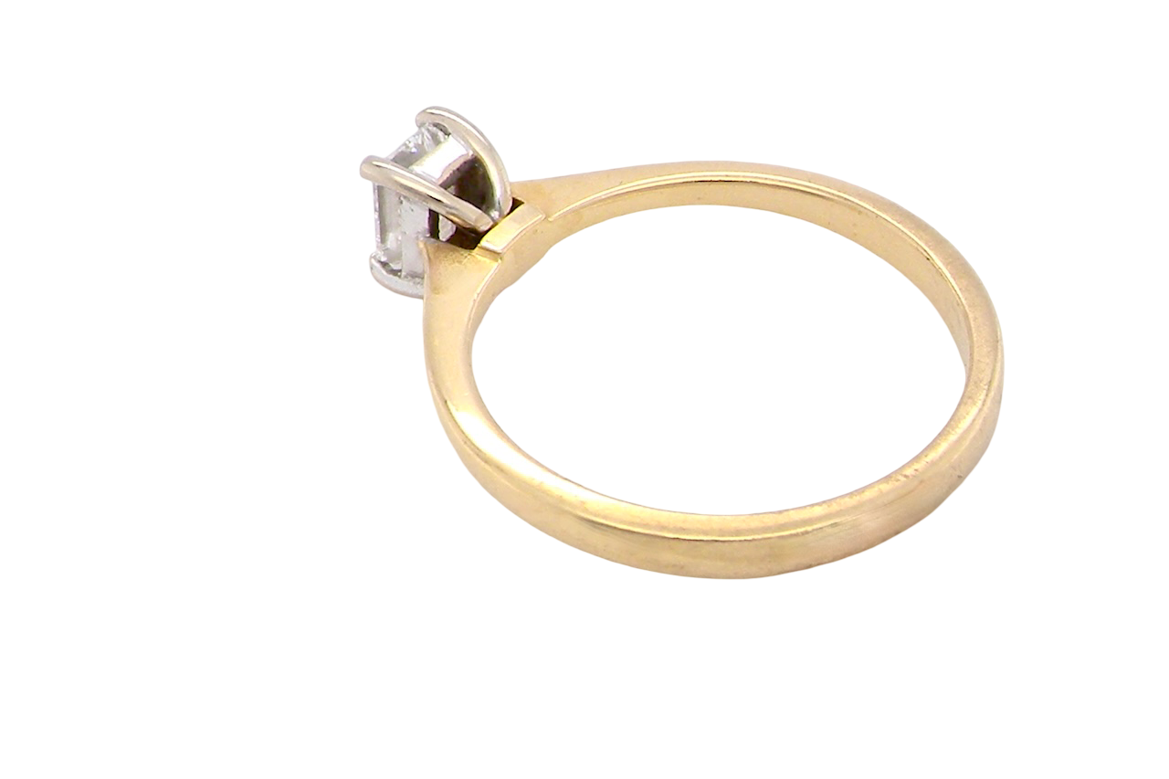 rear Elegant and timeless, this solitaire ring features a beautifully cut emerald-cut diamond measuring 5 x 4mm, confirmed at approximately 0.40 carats. The diamond is graded J colour and VS clarity, offering excellent sparkle and impressive clarity for everyday wear or a meaningful occasion piece.