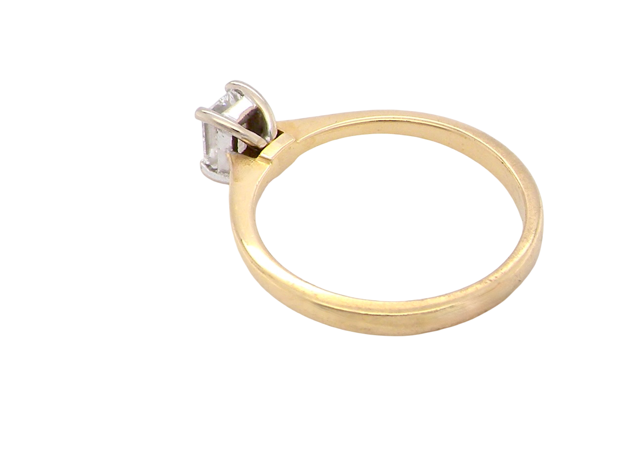 rear Elegant and timeless, this solitaire ring features a beautifully cut emerald-cut diamond measuring 5 x 4mm, confirmed at approximately 0.40 carats. The diamond is graded J colour and VS clarity, offering excellent sparkle and impressive clarity for everyday wear or a meaningful occasion piece.