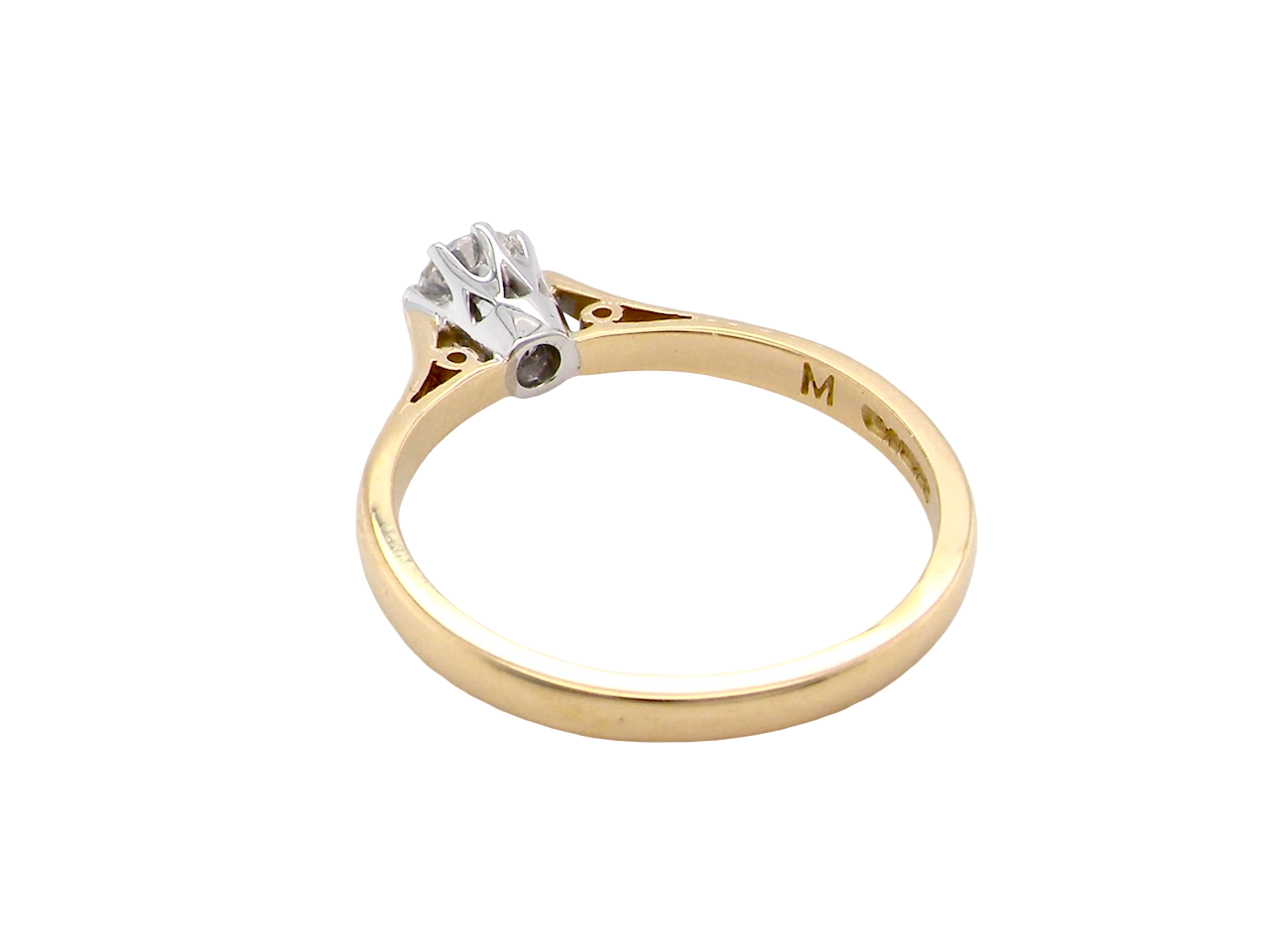 Gold ring with a diamond on a white background