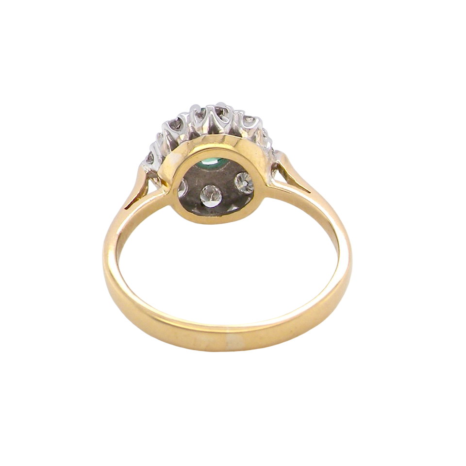 rear beautiful cluster ring featuring a 6mm round emerald