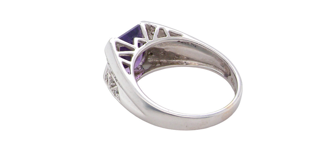 rear beautiful dress ring crafted in 14ct white gold (stamped 585), featuring a stunning rectangular-cut Tanzanite measuring approximately 9 x 7.5mm, estimated at 2.5 carats.