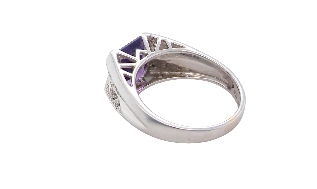 rear beautiful dress ring crafted in 14ct white gold (stamped 585), featuring a stunning rectangular-cut Tanzanite measuring approximately 9 x 7.5mm, estimated at 2.5 carats.