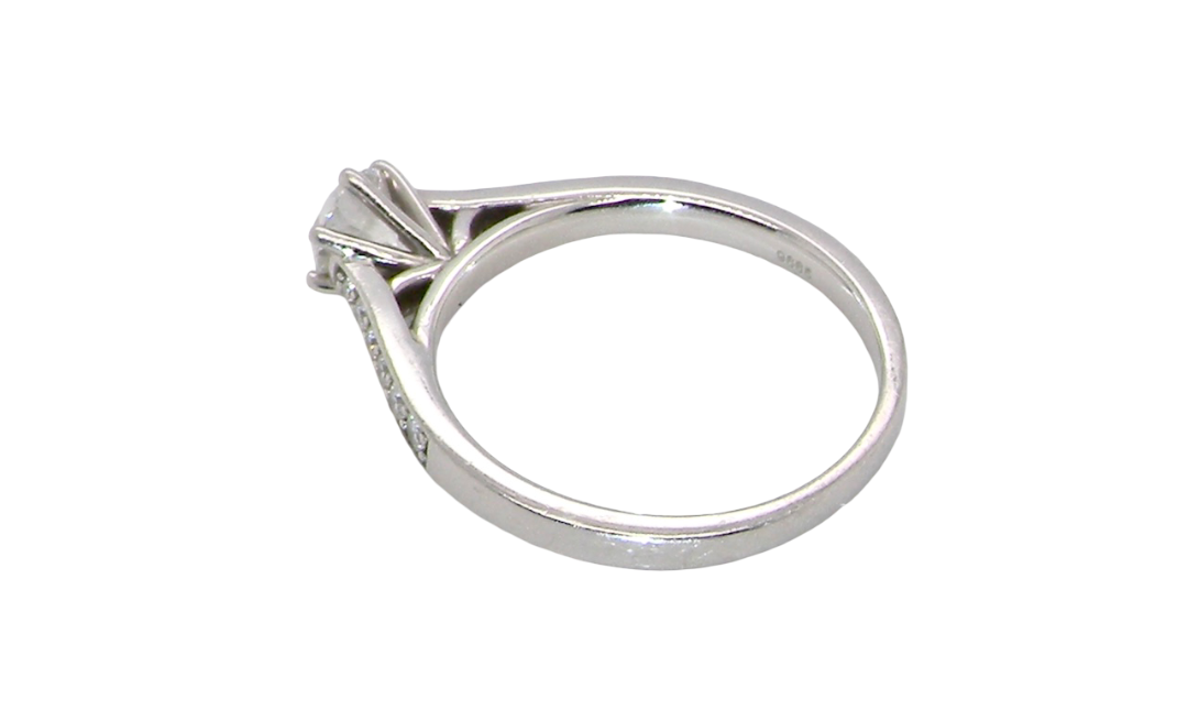 rear beautiful platinum solitaire ring featuring a brilliant-cut white diamond, claw set, measuring 4.8mm and weighing approximately 0.65ct. Diamond graded I colour, SI1 clarity, with an 88-facet cut.