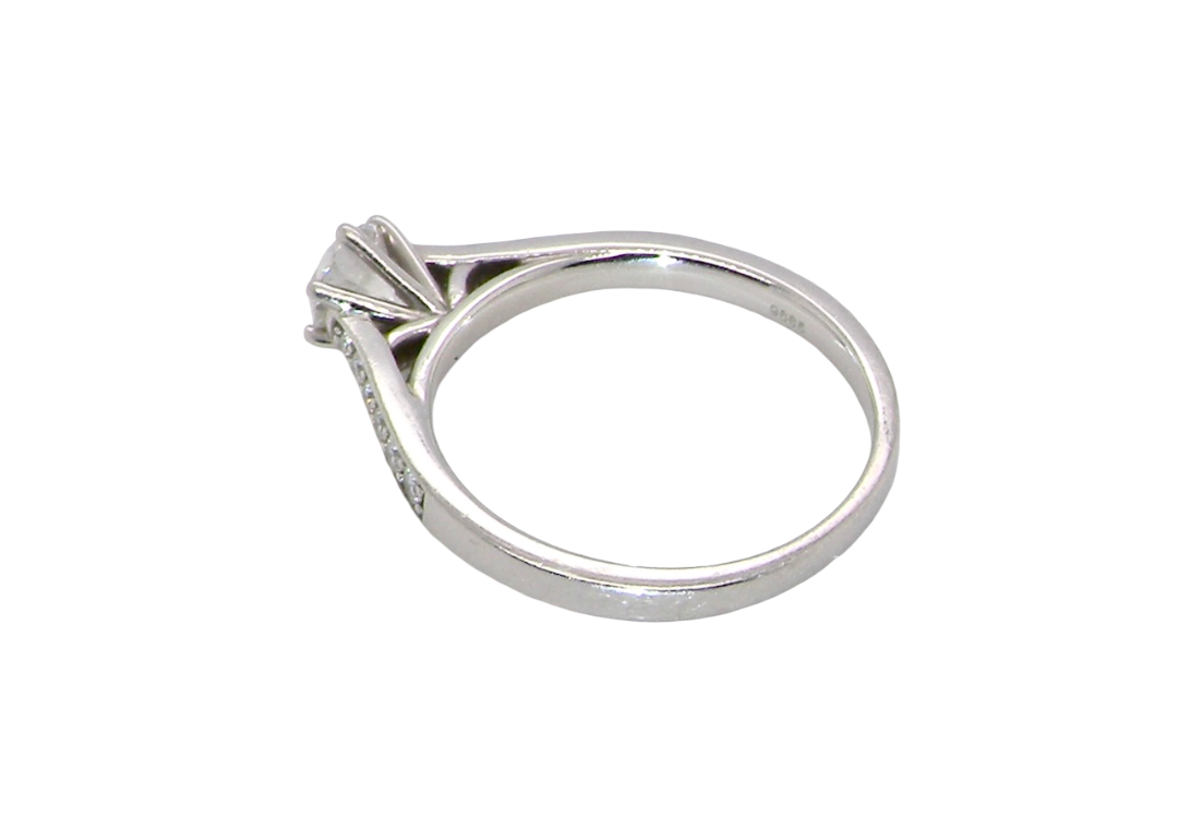rear beautiful platinum solitaire ring featuring a brilliant-cut white diamond, claw set, measuring 4.8mm and weighing approximately 0.65ct. Diamond graded I colour, SI1 clarity, with an 88-facet cut.