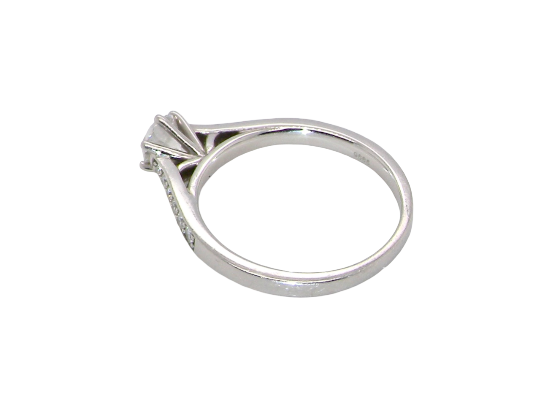 rear beautiful platinum solitaire ring featuring a brilliant-cut white diamond, claw set, measuring 4.8mm and weighing approximately 0.65ct. Diamond graded I colour, SI1 clarity, with an 88-facet cut.
