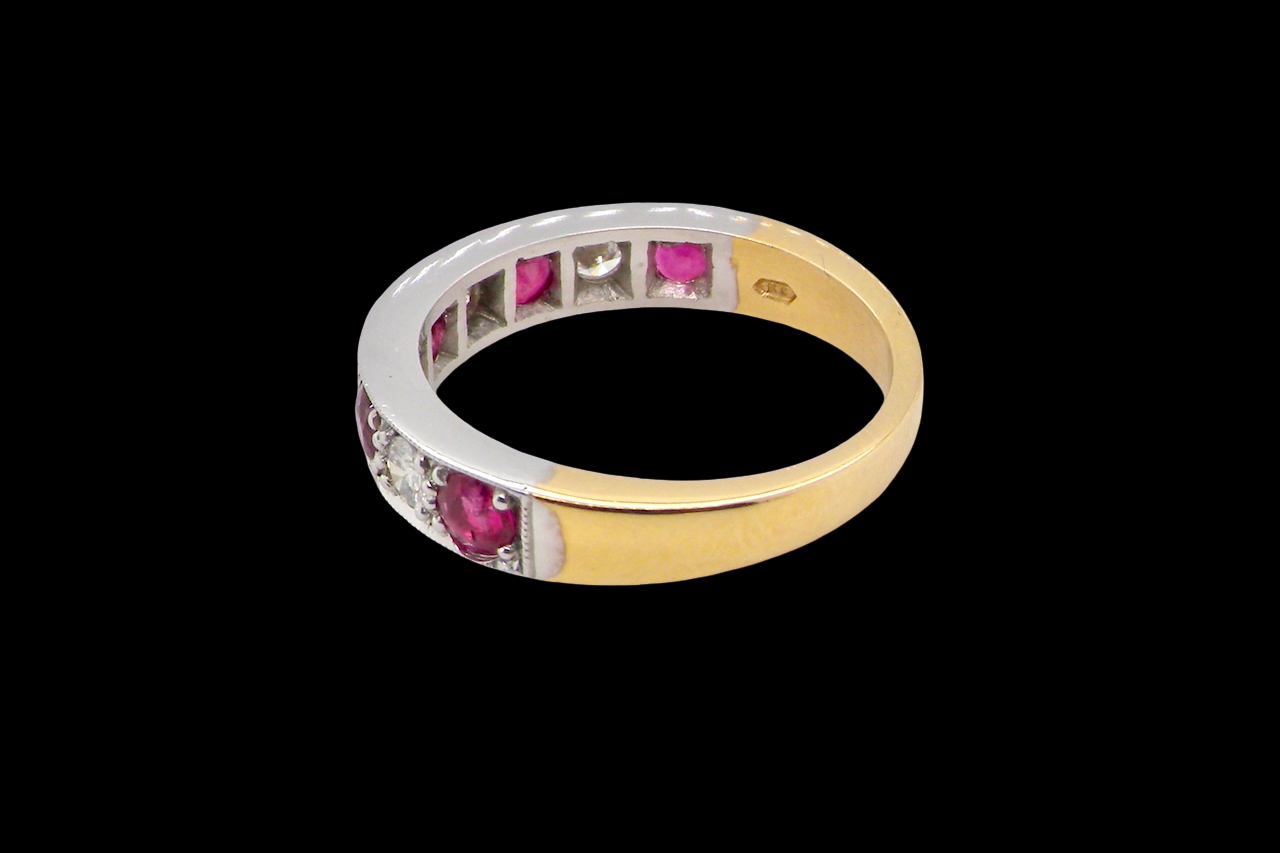 rear beautifully crafted 18 carat gold half-hoop eternity ring,