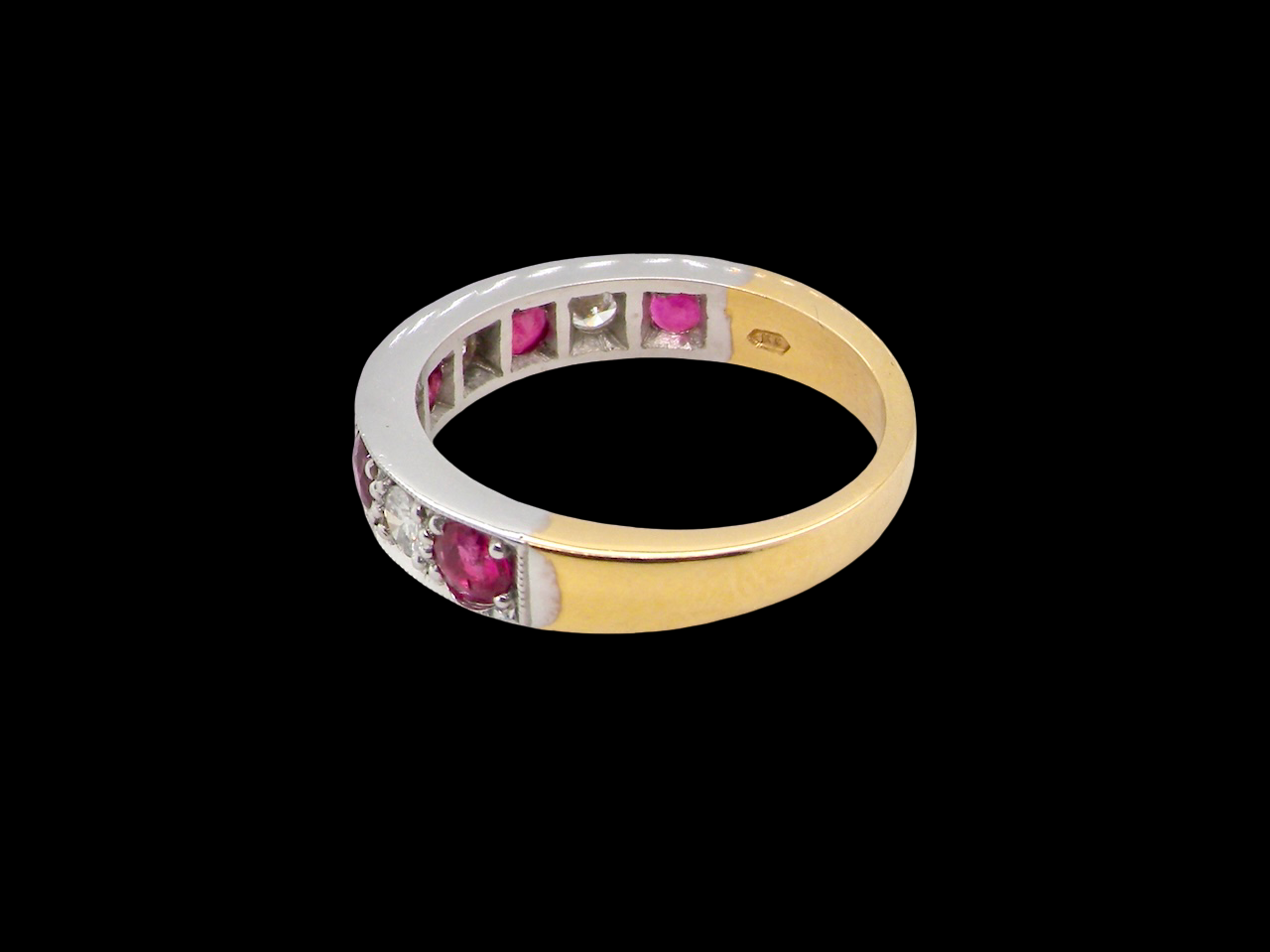 rear beautifully crafted 18 carat gold half-hoop eternity ring,