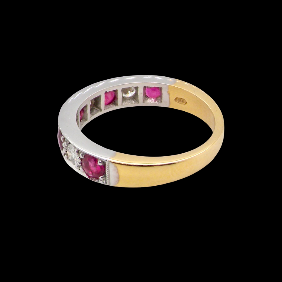 rear beautifully crafted 18 carat gold half-hoop eternity ring,